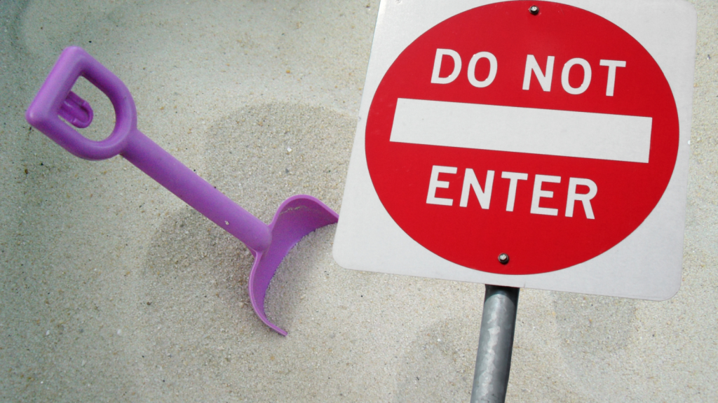 Meme with sand, toy shovel, and do not enter sign